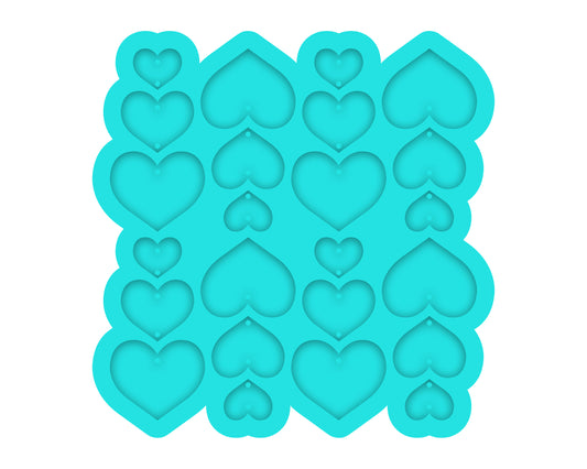 a cookie sheet with hearts cut out of it