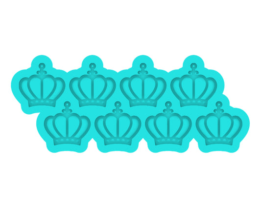 a set of six cookie cutters with crowns on them