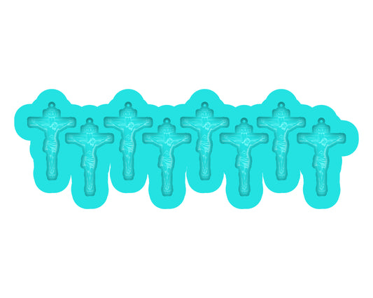 a row of blue plastic crucifixs on a white background